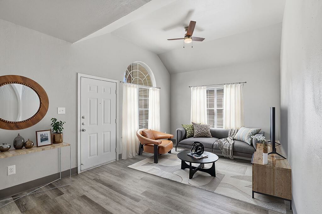 Living room with ceiling fan at Almeda Park Apartments in Houston TX